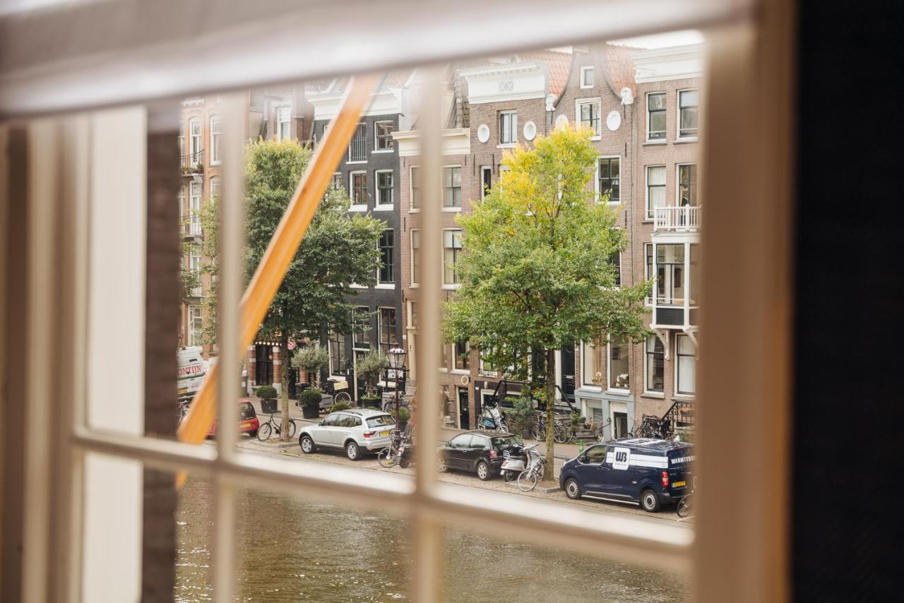Hotel 717 Amsterdam Exterior foto View from the window of a canal house in Amsterdam